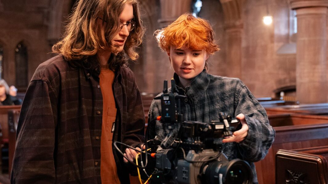 2 students using film equipment