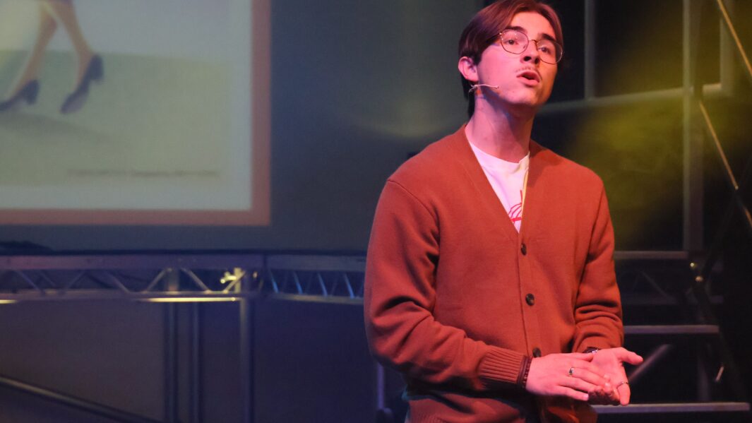 Boy on stage singing a sound of music song