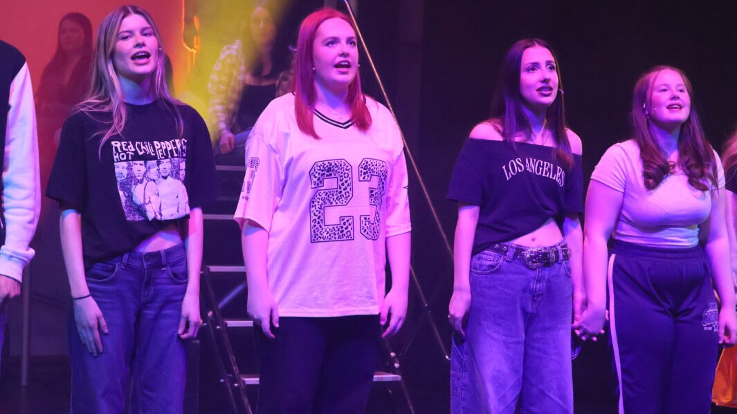 4 female students on stage on a production