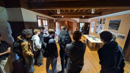 A group of students looking at artwork at Lancaster uni
