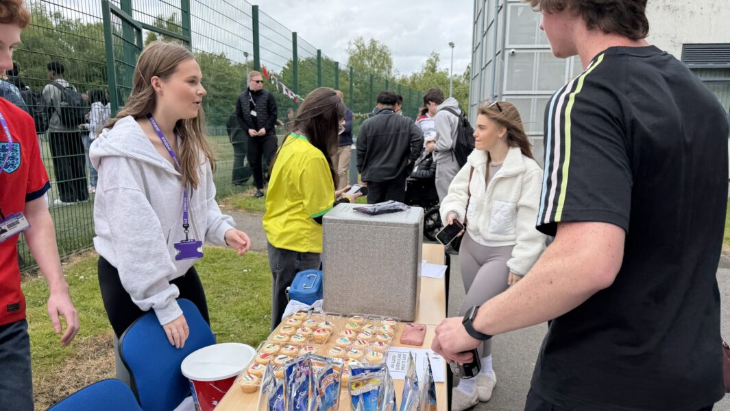 students selling goods for charity