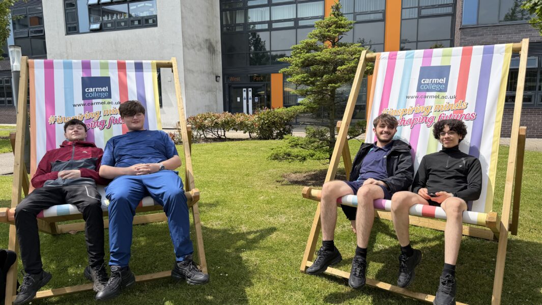 Students sat on giant deck chairs at Carmel