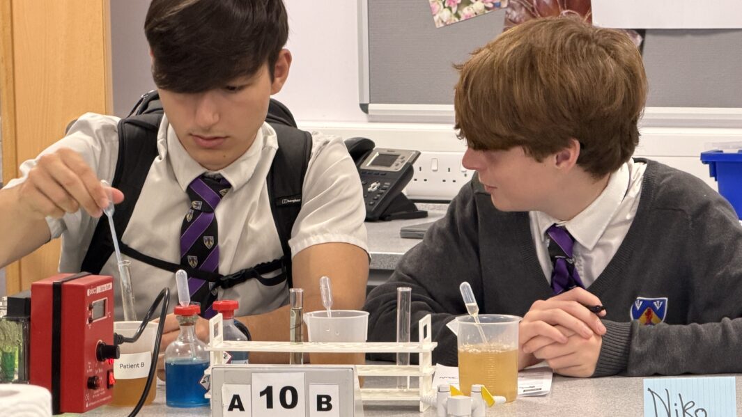 Two boys working in a science lab