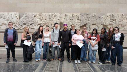 group photo of students at a museum