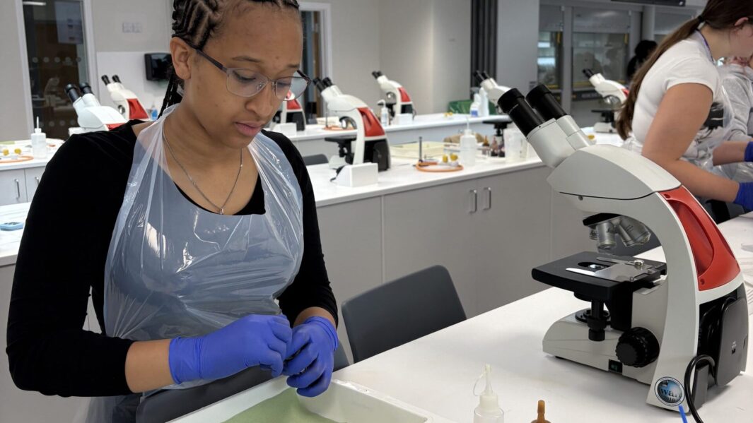 Female students doing experiments in a lab at Edge Hill Uni