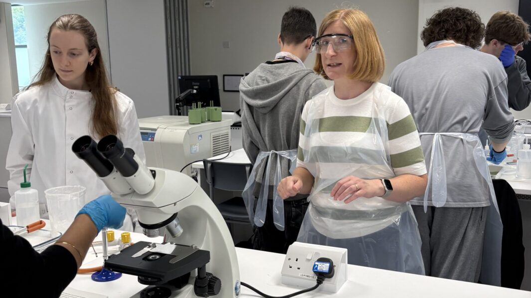 Students and staff member doing experiments in a lab at Edge Hill Uni