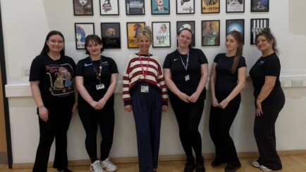 Carly and students pose for picture in workshop