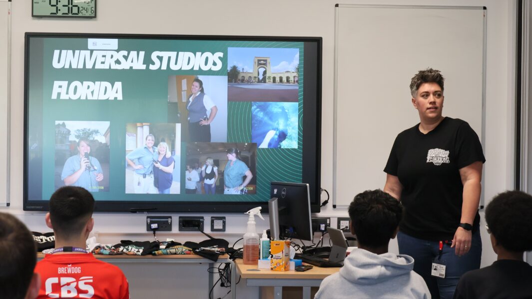 Faye speaking to a audience of students about her journey/career