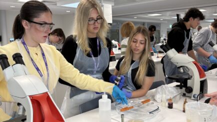 Female students doing experiments in a lab at Edge Hill Uni