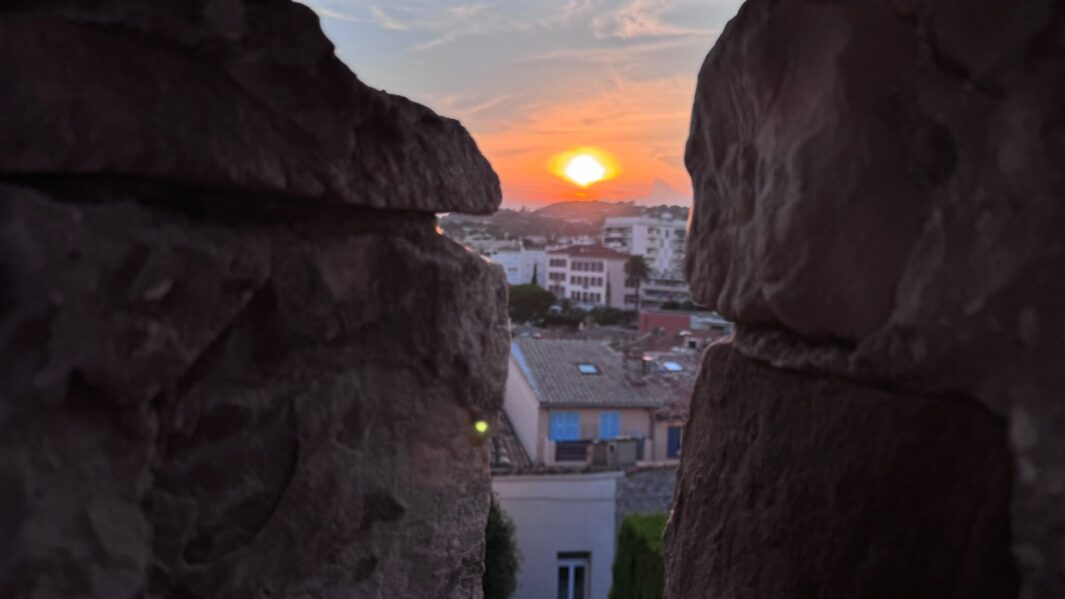 sun setting over the french city