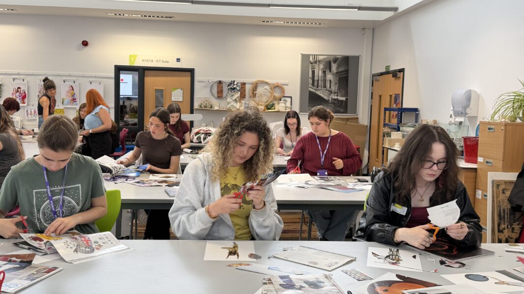 students can be seen cutting out paper for collage
