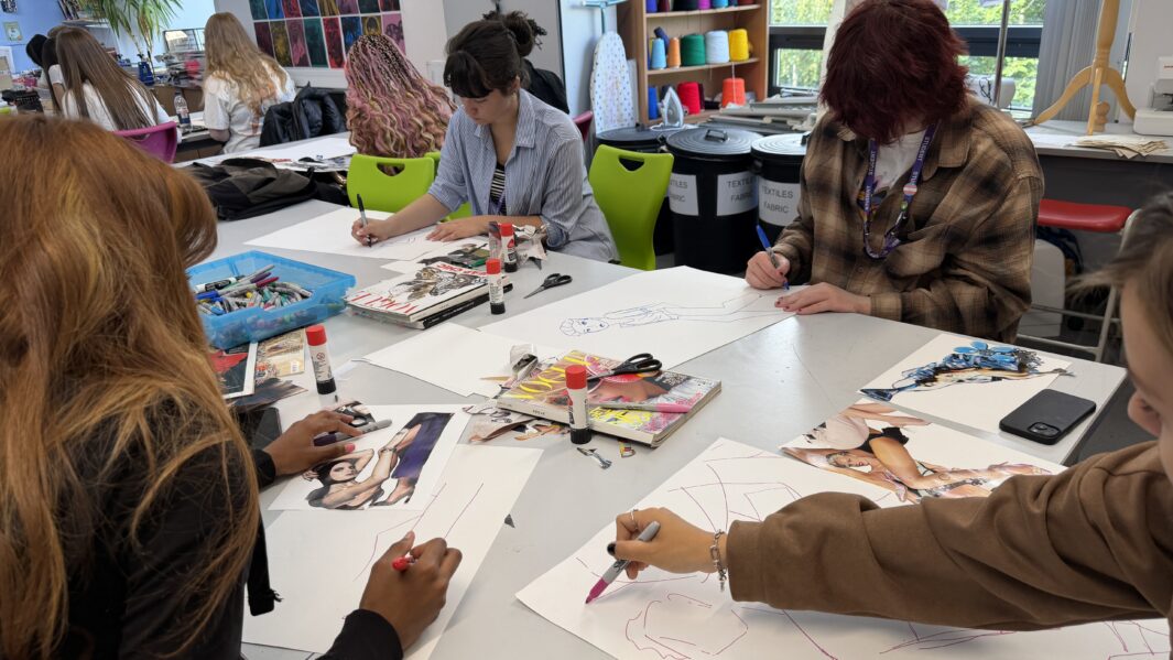 students collaging from magazin cuttings