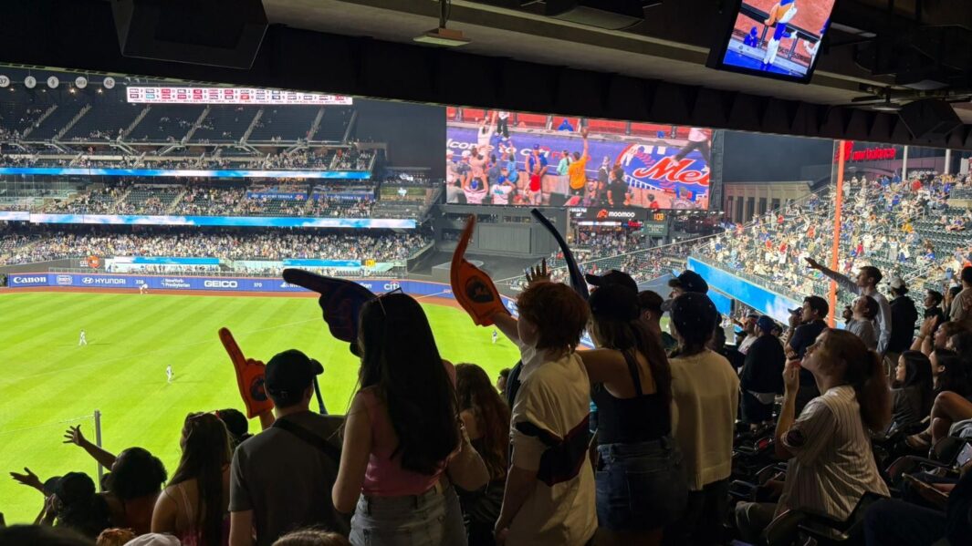A group of students in New York at the Met game