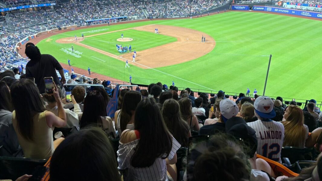 A group of students in New York at the met game