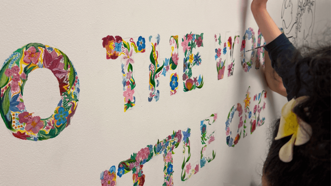 the colourful mural saying 'welcome to the world little one'
