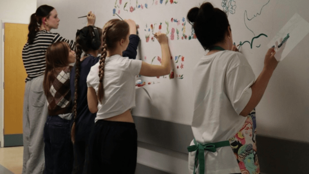 students paint mural
